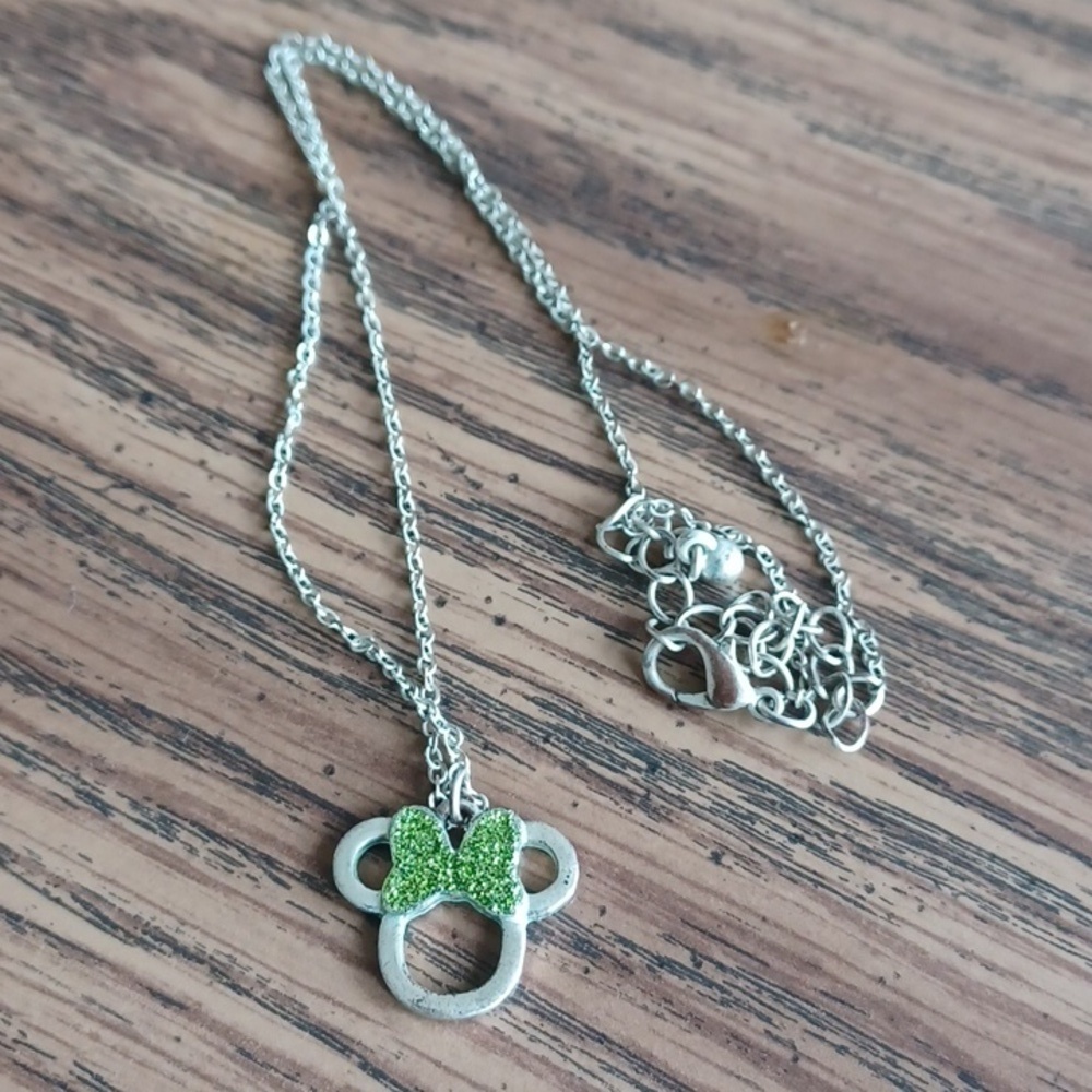 Disney silver toned necklace with Minnie Mouse pendant with green accent glitter